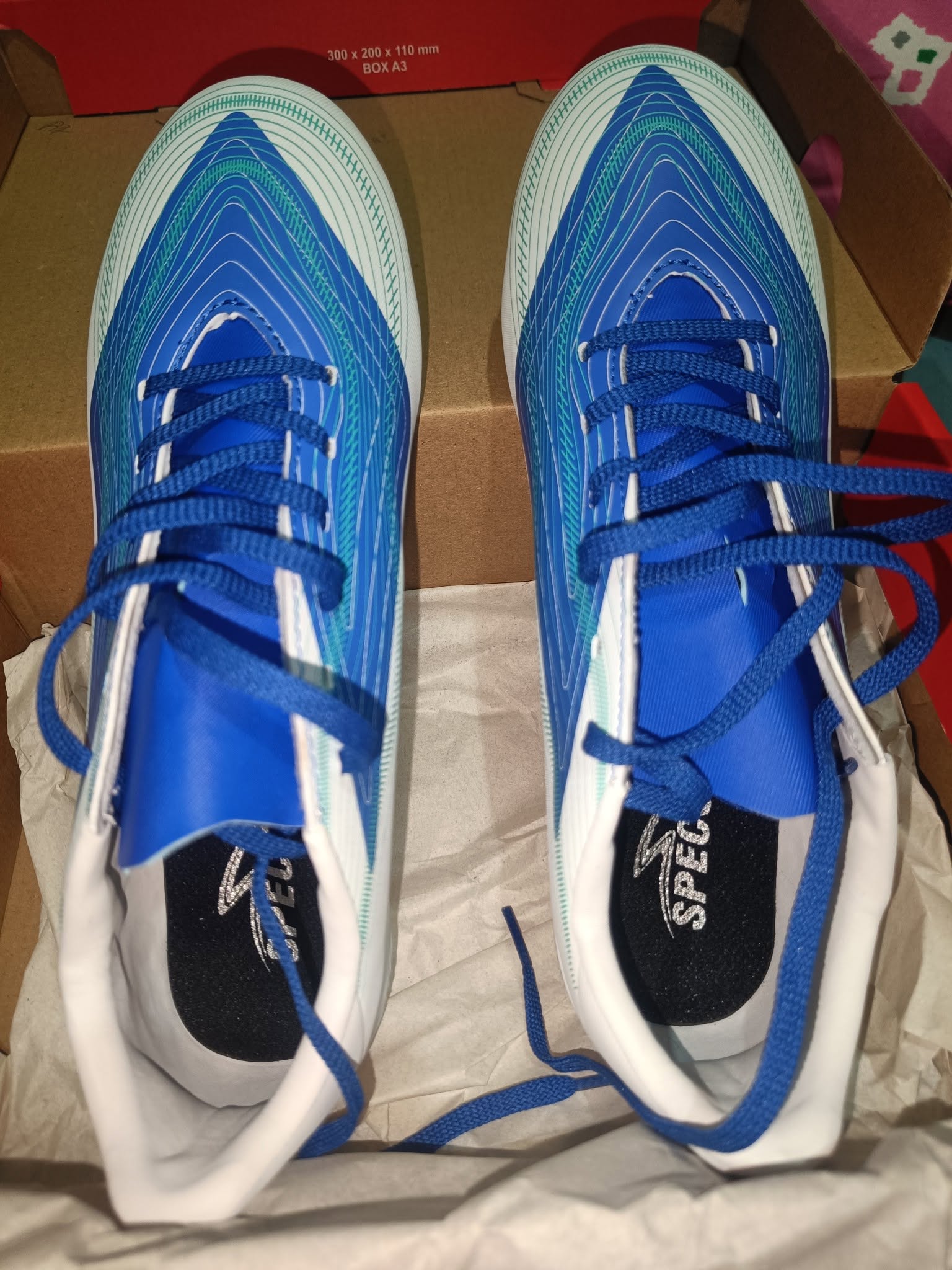 Jual Cepat Sepatu Sepak Bola SPECS Rhythm FG White / Dazzling Blue